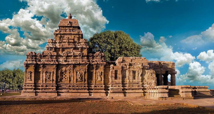 Beautiful temple with detailed carvings and blue sky.