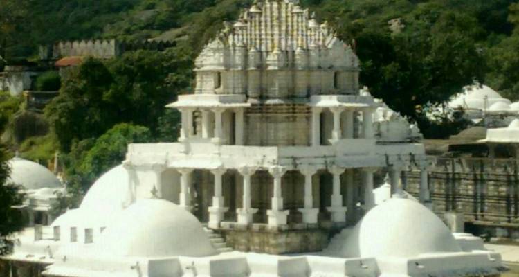 White temple with multiple domes.