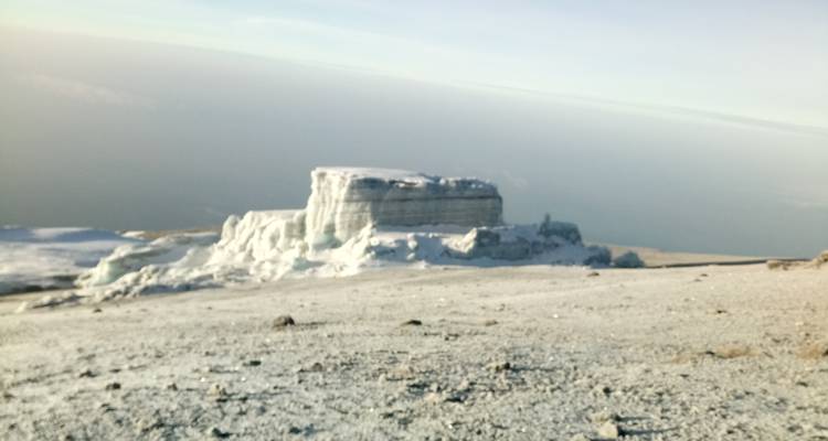 Blurry image of a glacier or icy landscape.