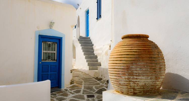 Characteristically Greek courtyard with a large terracotta pot.