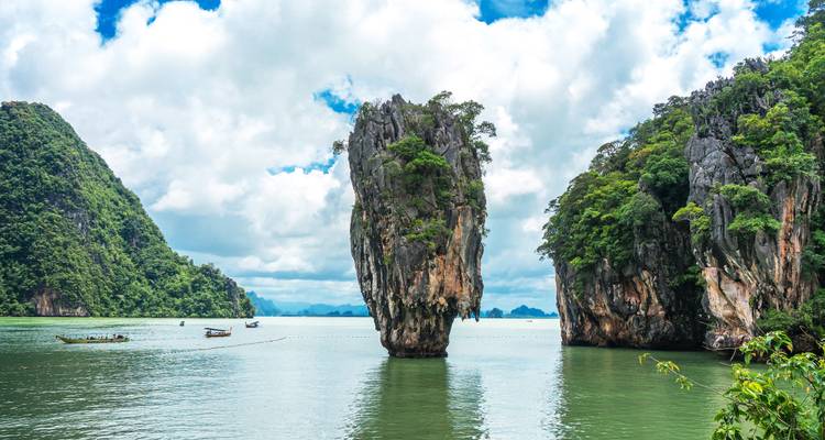 Iconic limestone pinnacle of James Bond Island rises from emerald Phang Nga Bay.