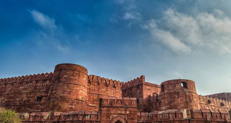 Historic red fort with blue sky as the background.