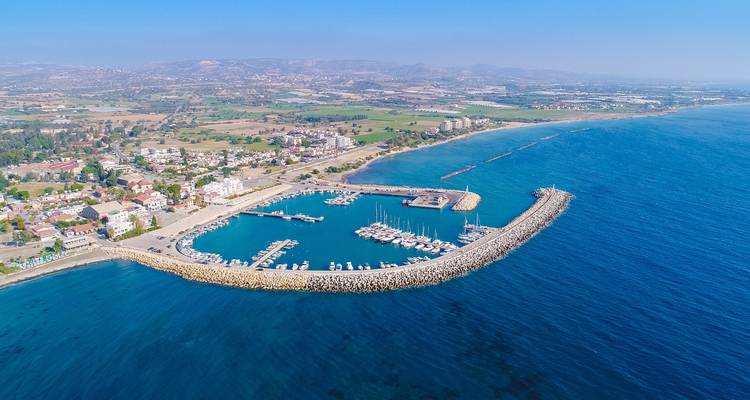 Aerial view of a coastal town and marina.