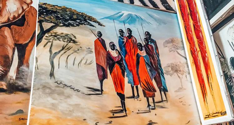 Colorful wall art depicting Maasai warriors beneath an acacia with Mount Kilimanjaro in the background.