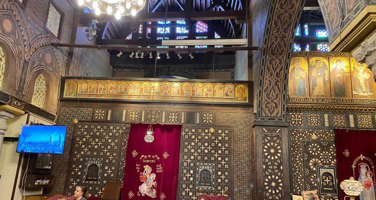 Interior of a historic church with stained glass.