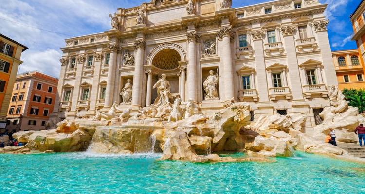 The Trevi Fountain with intricate sculptures and flowing water.
