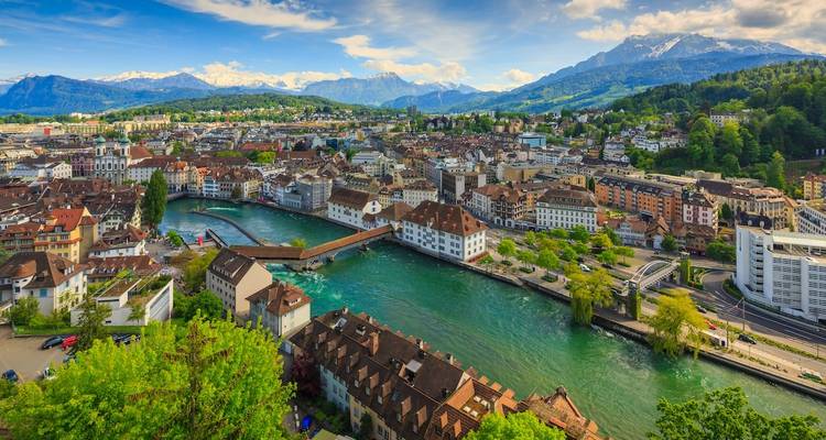 Lucerne city view with Reuss River and Swiss Alps.