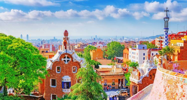 View of Park Güell in Barcelona with cityscape in the background.