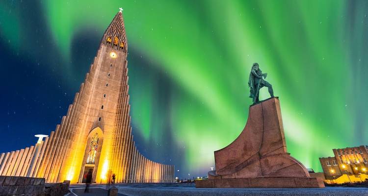Hallgrímskirkja with Northern Lights in Reykjavik.