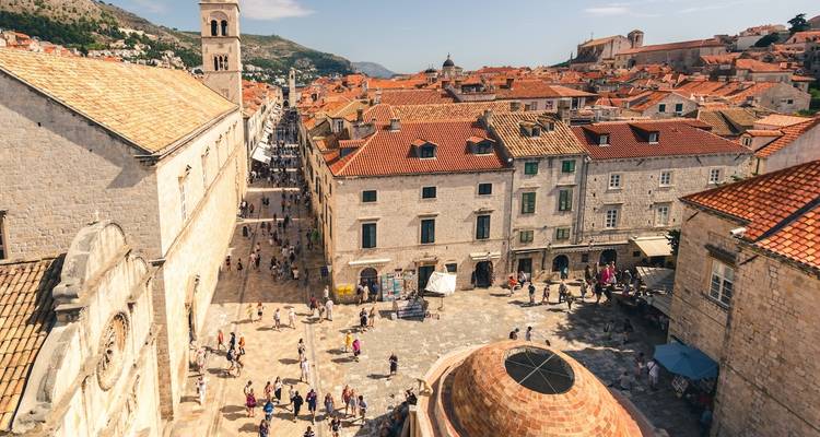 An overhead view of Dubrovnik, Croatia, with people in the city streets.