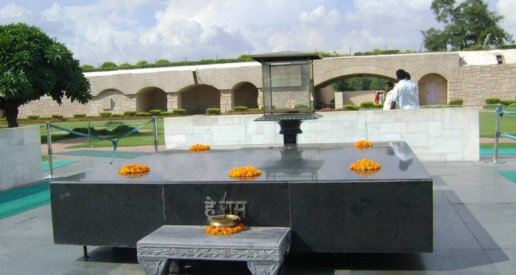 Memorial site with flowers and greenery.