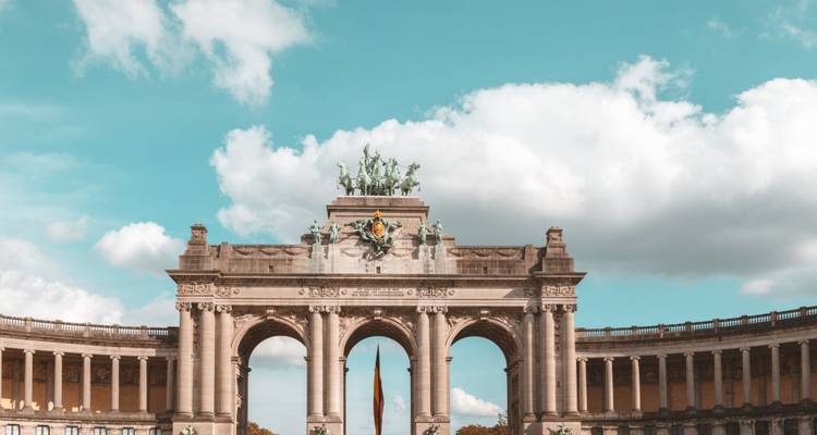 Monumental arch with a bronze statue on top.