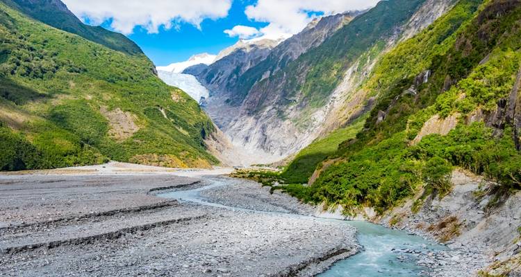 River flowing down from glacier in a valley.