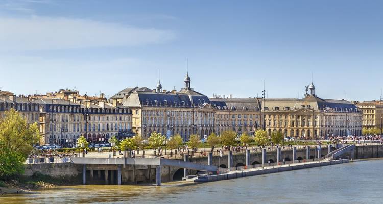 Buildings along the riverfront in Bordeaux with clear skies