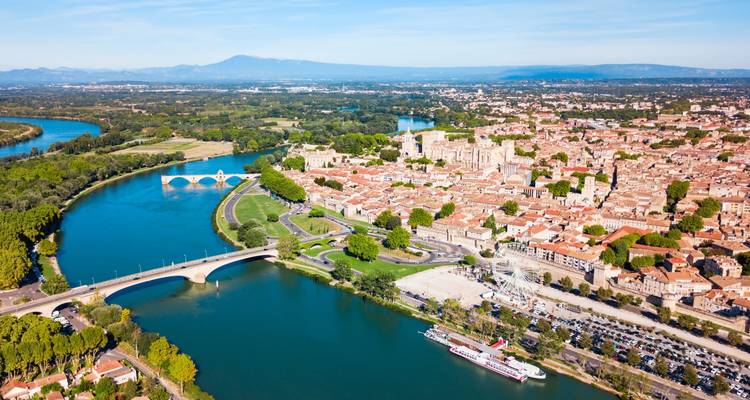 Aerial view of Avignon with water and historic buildings