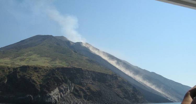 A mountain landscape with volcanic activity.
