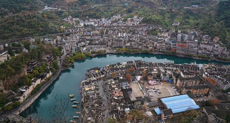 Aerial view of a city with a riverbend