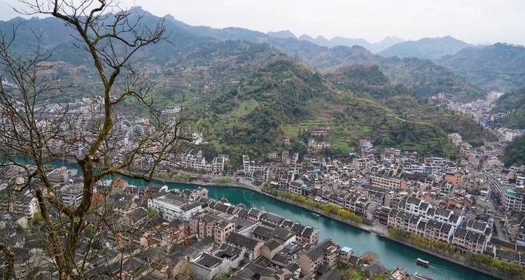 Scenic view of a river cutting through a town
