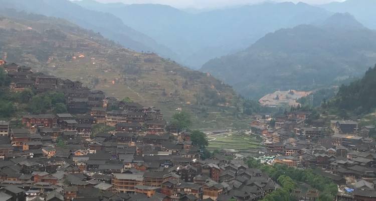 Hillside town with surrounding mountains