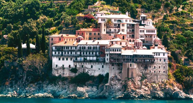 Imposing hilltop monastery with coastal views.