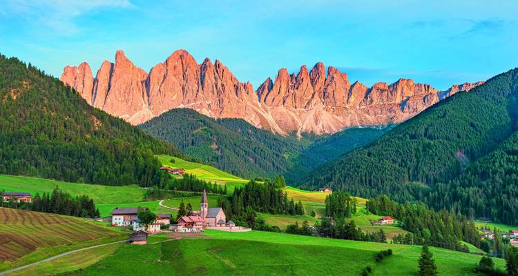 Dramatic mountain landscape with a church.