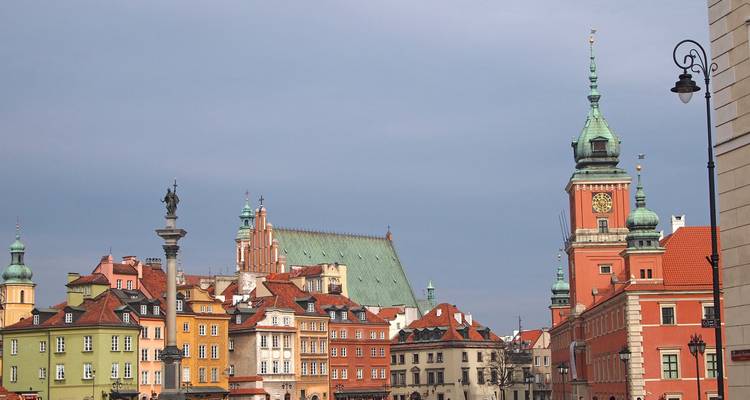 A historic square with colorful buildings and a clock tower.