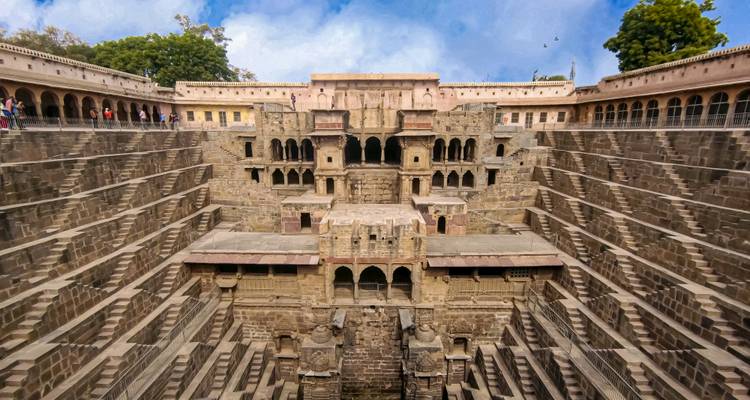 Sweeping view down the intricate geometric steps of Chand Baori stepwell in Rajasthan.