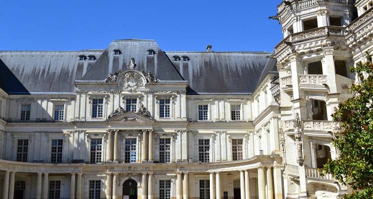 Detailed view of a French chateau facade.
