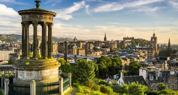 View from Calton Hill over Edinburgh with monuments and skyline.