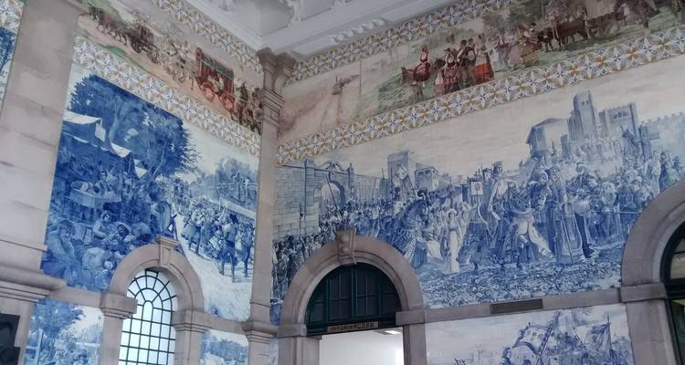 Interior with ornate blue and white tile artwork.
