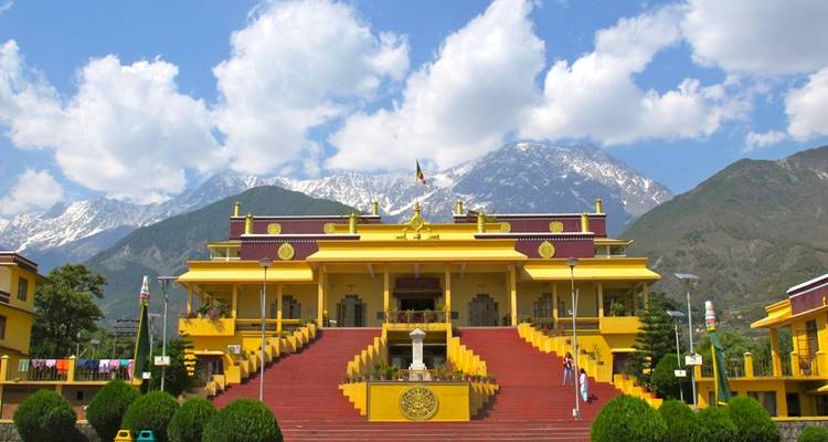 Colorful building with mountains in the background.