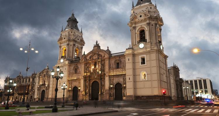 View of a grand church with dramatic lighting.
