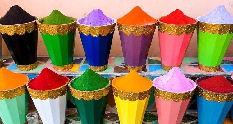 Colorful cones filled with powdered pigments on display.