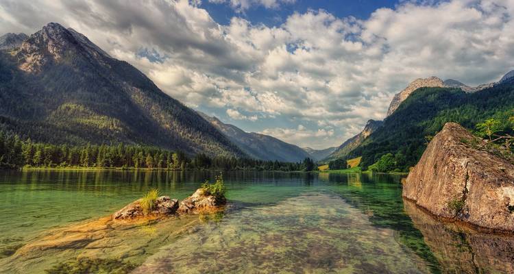 Beautiful lake with mountainous backdrop and reflections.