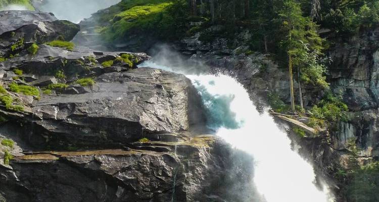 A powerful waterfall cascading down rock formations.