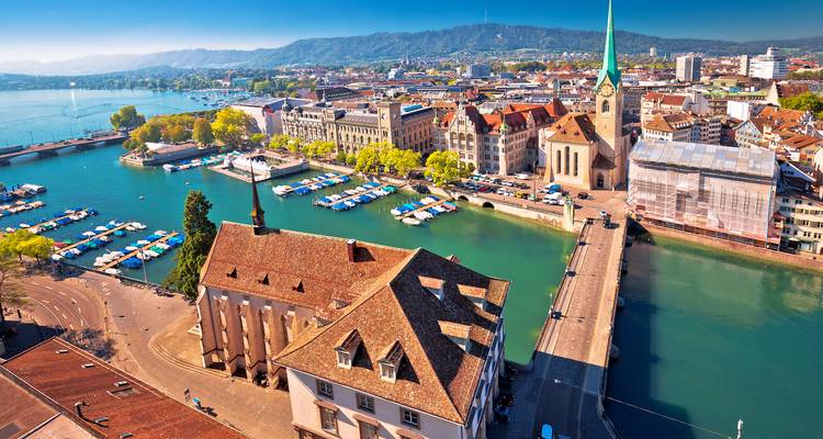 An aerial view of Zurich showcasing the cityscape and water body.