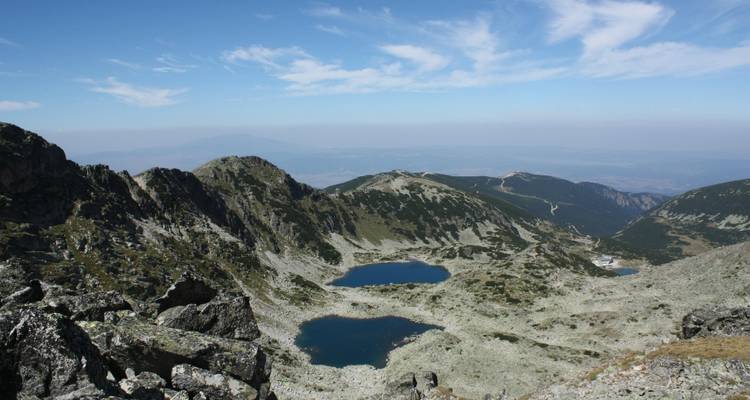Mountain landscape with lakes reflecting the sky.