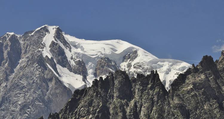 Close-up of a snow-capped mountain with rugged peaks.