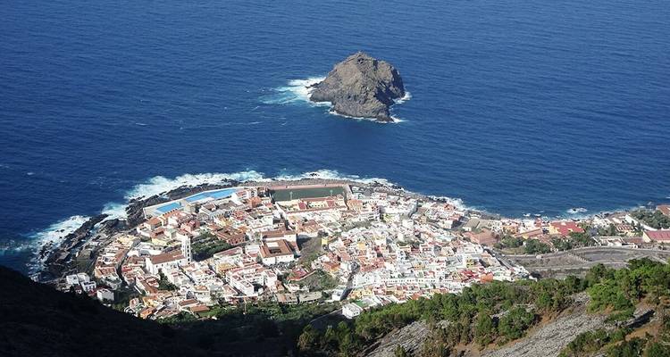 Coastal town with an islet seen from above.