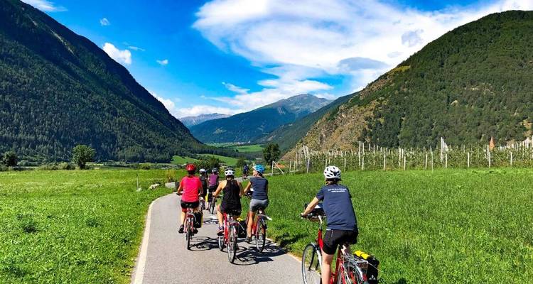 Cyclists enjoying a mountainous countryside.