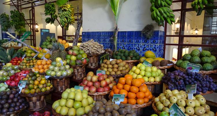 Colorful marketplace with various fruits.