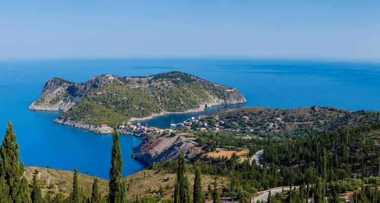 Scenic view of a peninsula with a settlement by the sea.