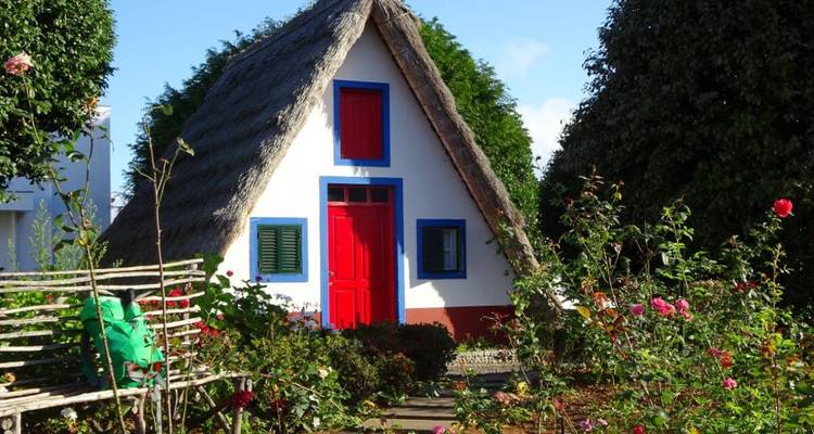 Traditional Madeira house with a thatched roof.