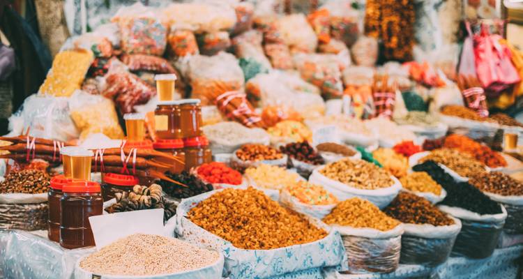Market stall showcasing a variety of spices and goods.