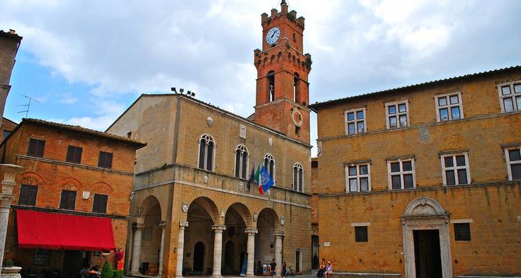 Historic town square with clock tower and buildings.
