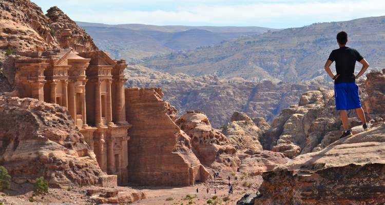 Man overlooking the archaeological site of Petra.