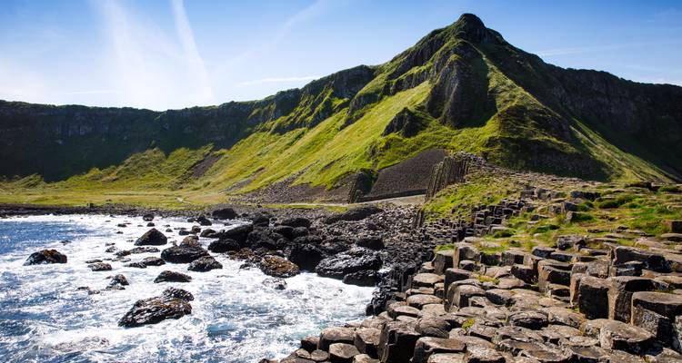 Giant's Causeway with iconic hexagonal basalt columns meeting rough seas.