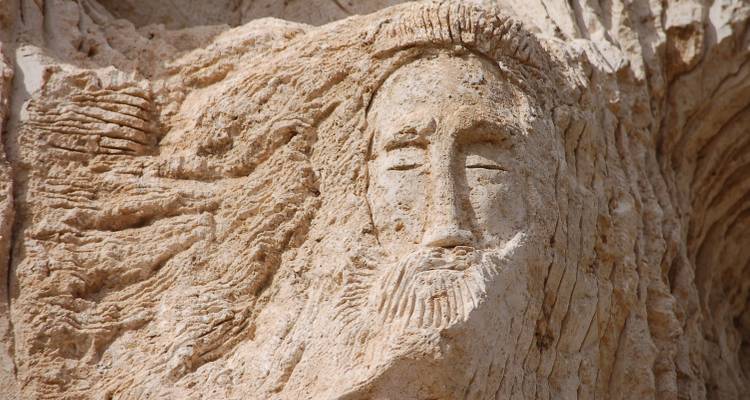Close-up of a carved rock face depicting a head.