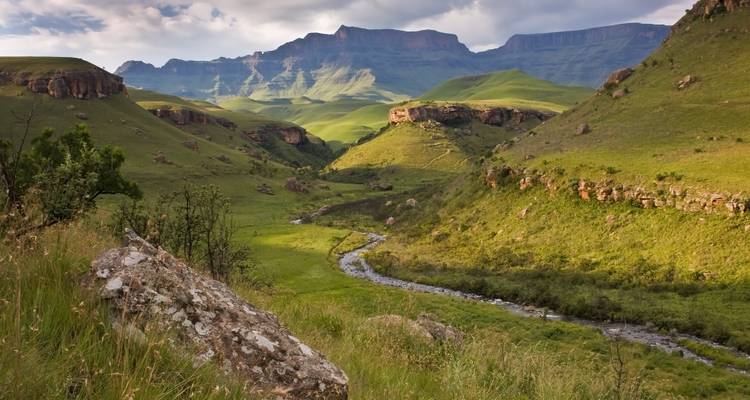 Scenic view of green valleys and mountains, possibly in Drakensberg.
