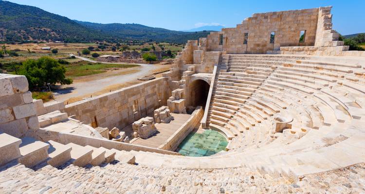 Well-preserved ancient amphitheater with surrounding landscape.